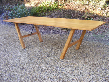 Oak dining table with steel supports